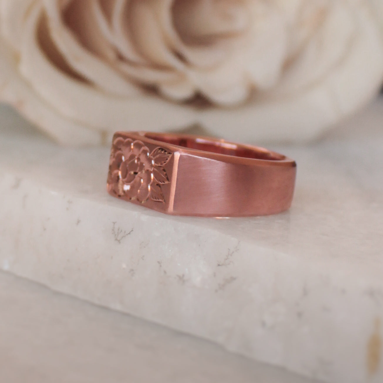 lush rose gold signet ring , with a single rose engraved on side and top