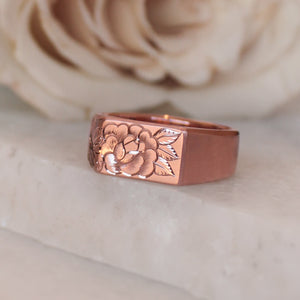 lush rose gold signet ring , with a single rose engraved on side and top
