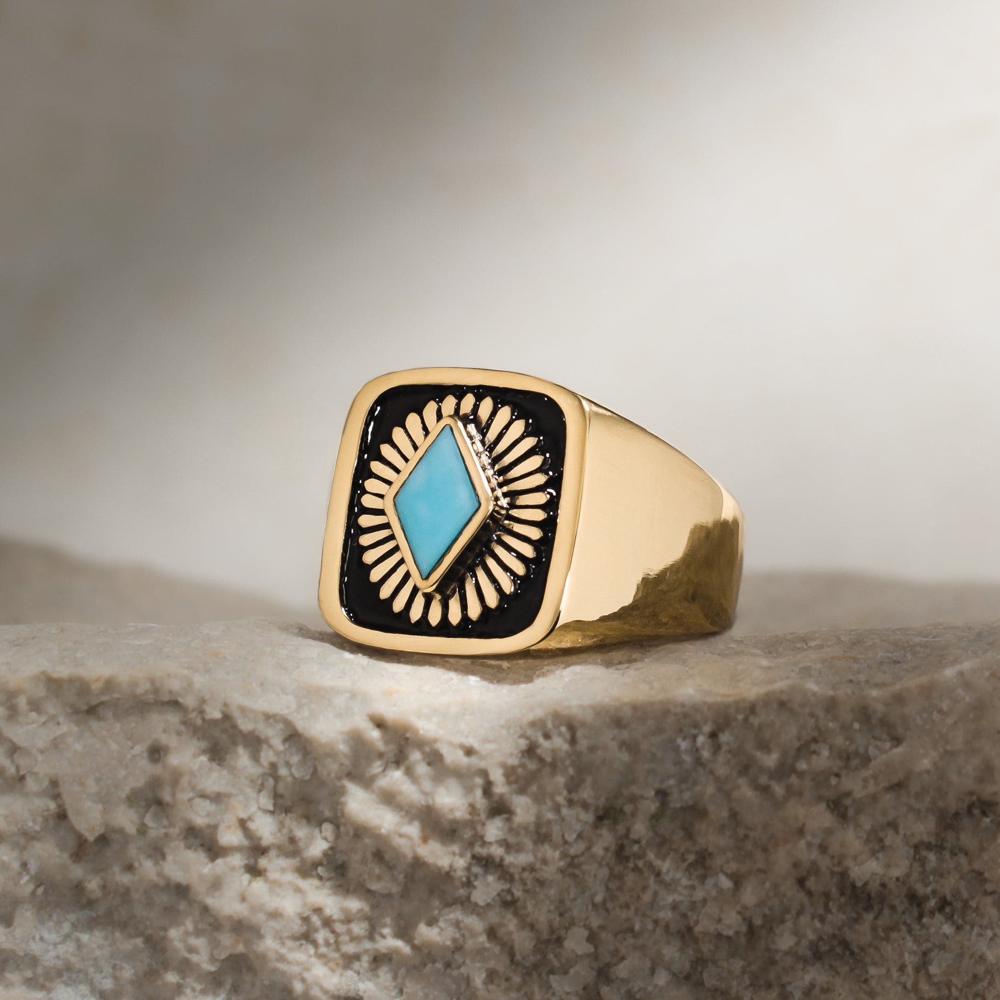 Eye-catching ring with a turquoise centerpiece and black enamel background, perfect for adding a pop of color to any outfit